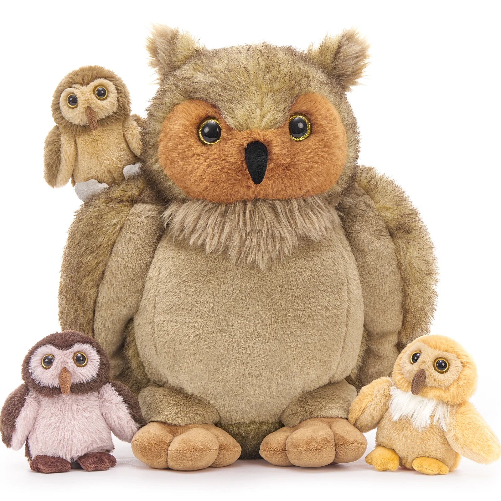 Set of plush owl toys in various sizes on a white background