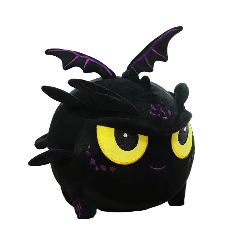 Black plush toy with yellow eyes on a wooden surface