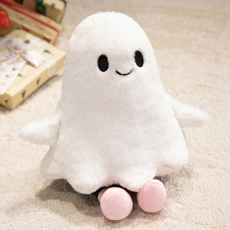 White plush ghost toy with pink feet on a beige carpet